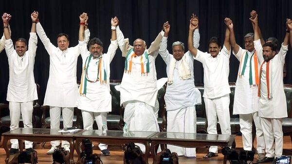 Congress national president Mallikarjun Kharge along with Karnataka Congress chief DK Shivakumar, former CM Siddaramaiah, and Randeep Surjewala with others display a show of strength as party wins Karnataka assembly elections, in Bengaluru on Saturday. (ANI)