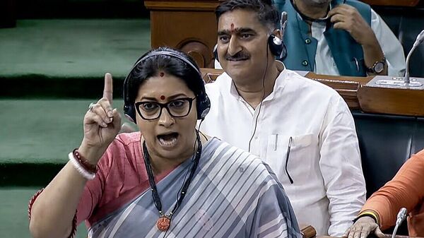 Union Minister Smriti Irani speaks in Lok Sabha during the ongoing Monsoon Session of Parliament, in New Delhi on Wednesday (ANI)