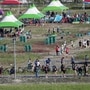 Attendees of the World Scout Jamboree move to leave a scout camping site in Buan, South Korea, Tuesday, Aug. 8, 2023. South Korea will evacuate tens of thousands of scouts by bus from a coastal jamboree site as Tropical Storm Khanun looms, officials said Monday. (Image: AP)
